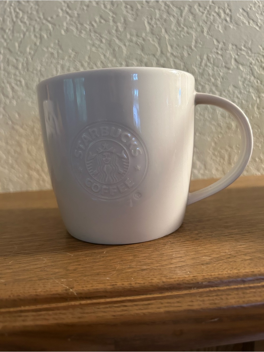 Starbucks white embossed mug